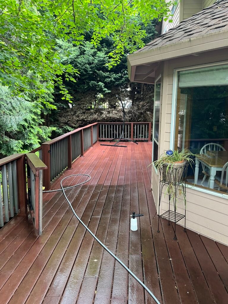 Outdoor wood balcony pressure washed by Home Cleaning Pros LLC using our eco-friendly cleaning solutions