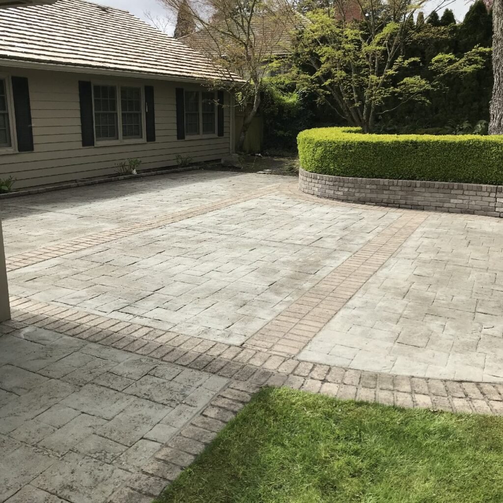 Stone and Brick patio professionally pressure washed by Home Cleaning Pros LLC using our eco-friendly cleaning solutions